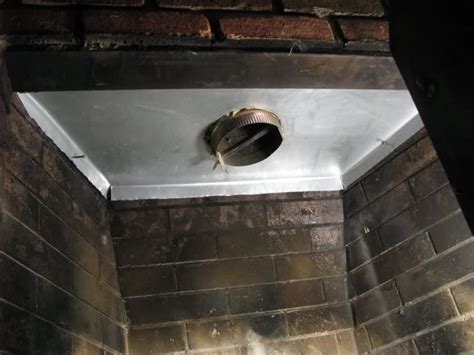 There are a few products you can purchase to block the chimney. . Fireplace block off plate